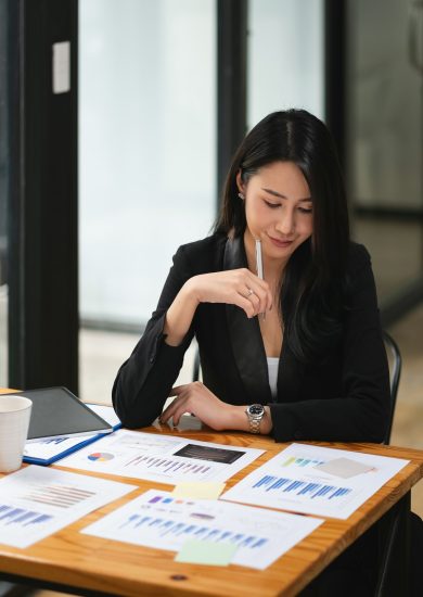 Portrait Of Attractive Asian Businesswoman Working for marketing plan. business analysis,financial